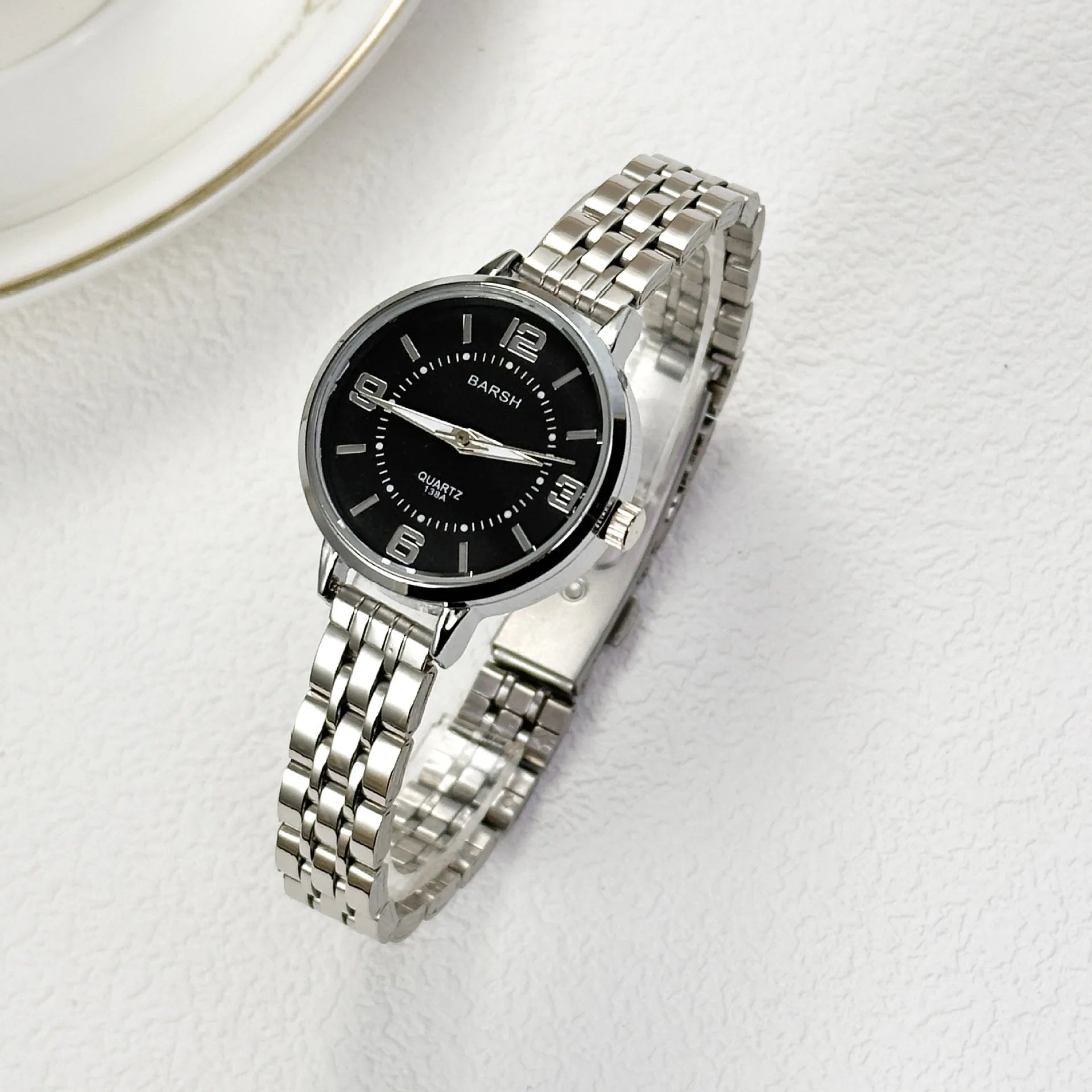 Elegant women’s silver watch with a polished stainless steel bracelet and clean white dial. Timeless, refined, and perfect for everyday luxury