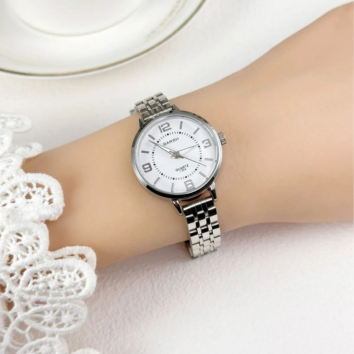 Elegant women’s silver watch with a polished stainless steel bracelet and clean white dial. Timeless, refined, and perfect for everyday luxury