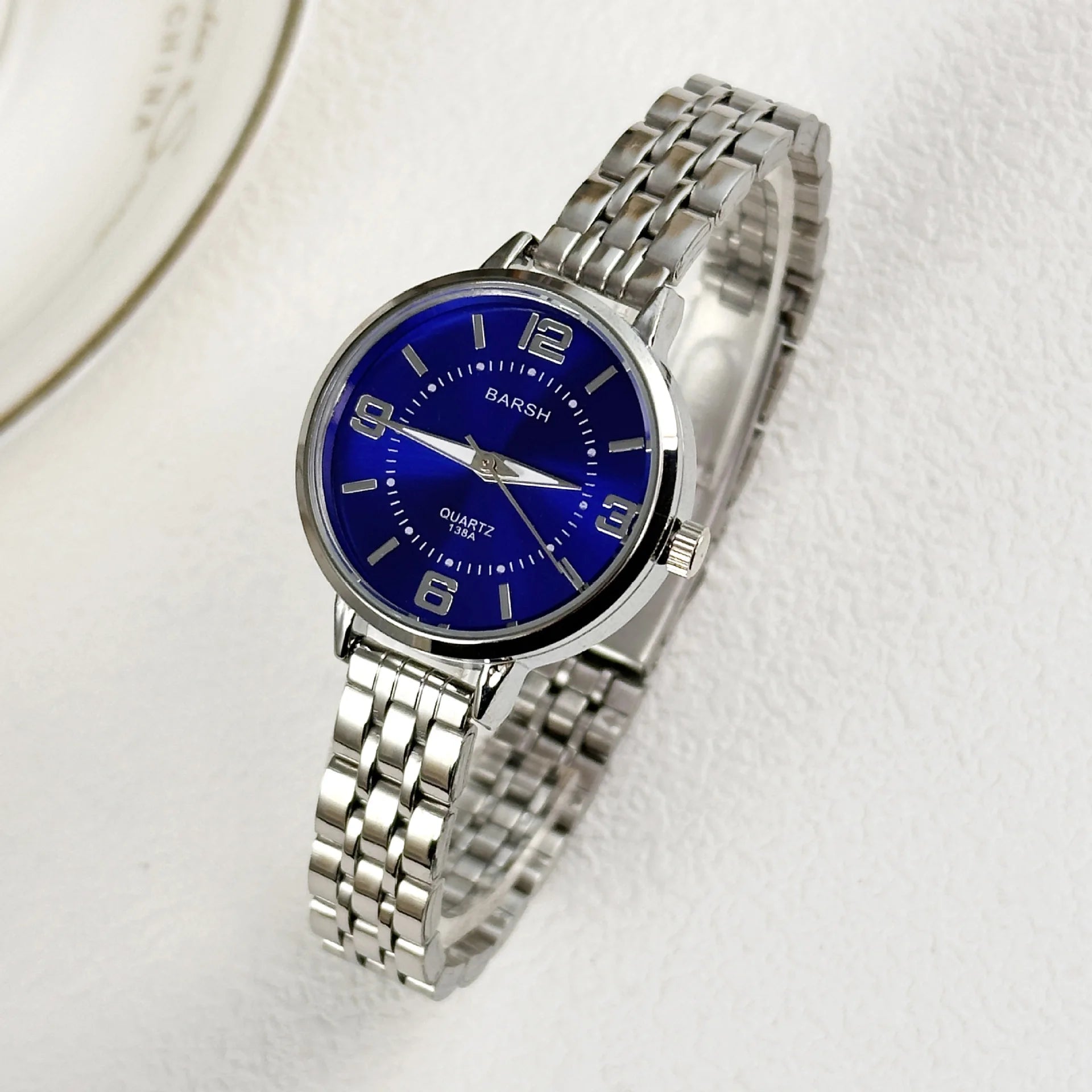 Elegant women’s silver watch with a polished stainless steel bracelet and clean white dial. Timeless, refined, and perfect for everyday luxury