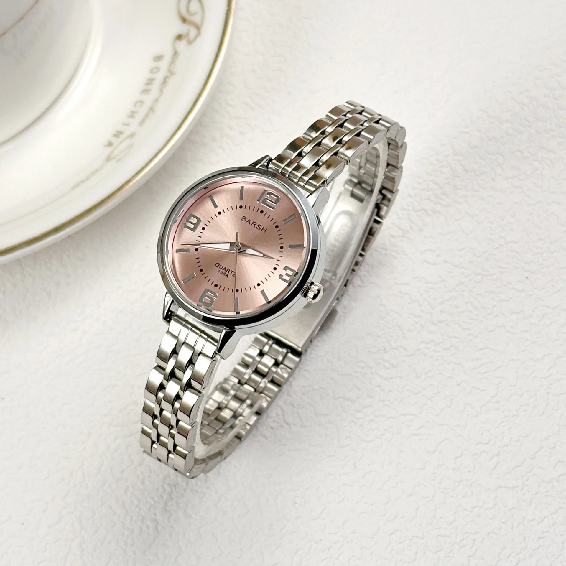 Elegant women’s silver watch with a polished stainless steel bracelet and clean white dial. Timeless, refined, and perfect for everyday luxury