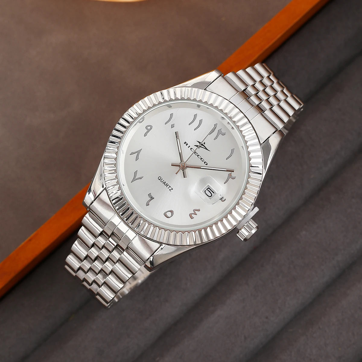 Classic steel timepiece with a textured bezel, clean dial, and reliable quartz movement.